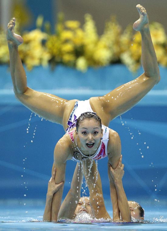 Perfection: The team from China hold a pose in the pool