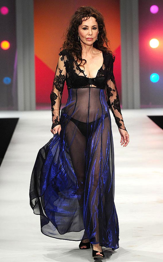 Marie Helvin in a sheer black negligee