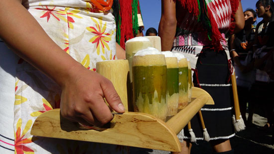 Rice beer is a staple at Hornbill Festival, served in bamboo glasses