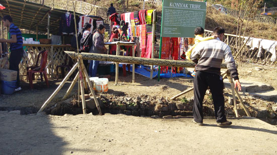 Drinking water flowing through this bamboo pipe with nosels, a tribal way of getting pure water to drink